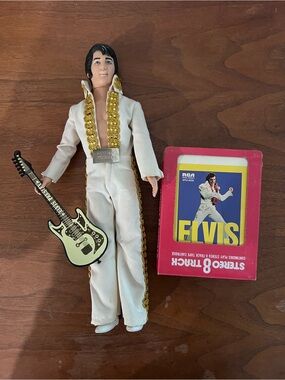 Vintage collectible Elvis Presley 12” doll and 8-track.
